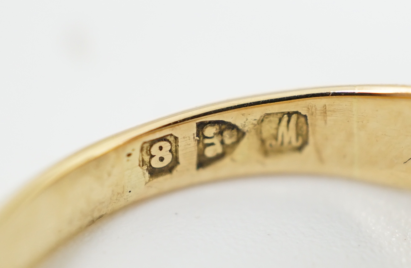A George V 18ct gold and solitaire diamond gypsy set ring